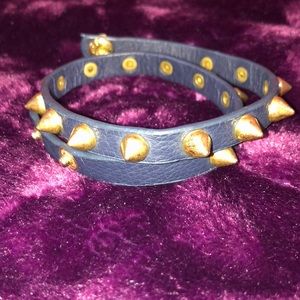 Black leather bracelet with gold studs